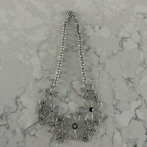 Costume jewelry necklace flower design with black inset